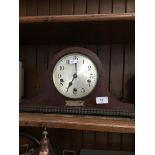 A vintage Baduf tambour mantel clock with pendulum and key.