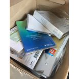 A box of office stationary items.