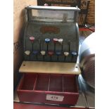 A childs vintage Kodeg cash register