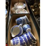 A box of blue and white tea ware and a box of plates etc