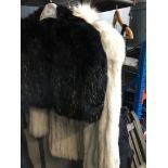 A fur jacket and a fur shrug.