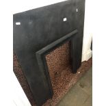 A cast metal fire surround