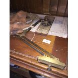 A WWII navigation board, R.A.F. map and leather flying helmet.