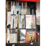 A box of computer games, DVDs and a box of various cables