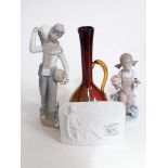 A Lladro figure, a Lladro plaque, a Spanish porcelain figure and a glass ewer.