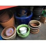 Large quantity of stoneware and terracotta garden planters.