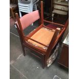 A pair of teak chairs