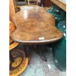 A 19th century walnut side table with 4 pillar pedestal base.