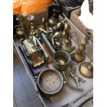 A box of various mixed brassware