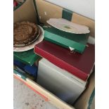 A box of collectors plates