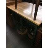 A kitchen bar style table with two stools