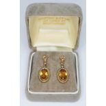 A pair of hallmarked 9ct gold citrine drop earrings, length 26mm, gross wt. 3.74g.