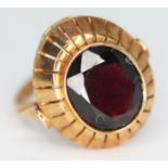 A garnet set ring, marked '585', gross wt. 5.18g, size M.