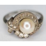 A white metal cultured pearl and colourless stone ring, marked '9ct', gross wt. 4.67g, size Q.