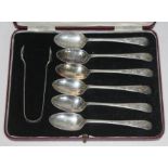 A set of six hallmarked silver teaspoons and sugar tongs, with associated case.