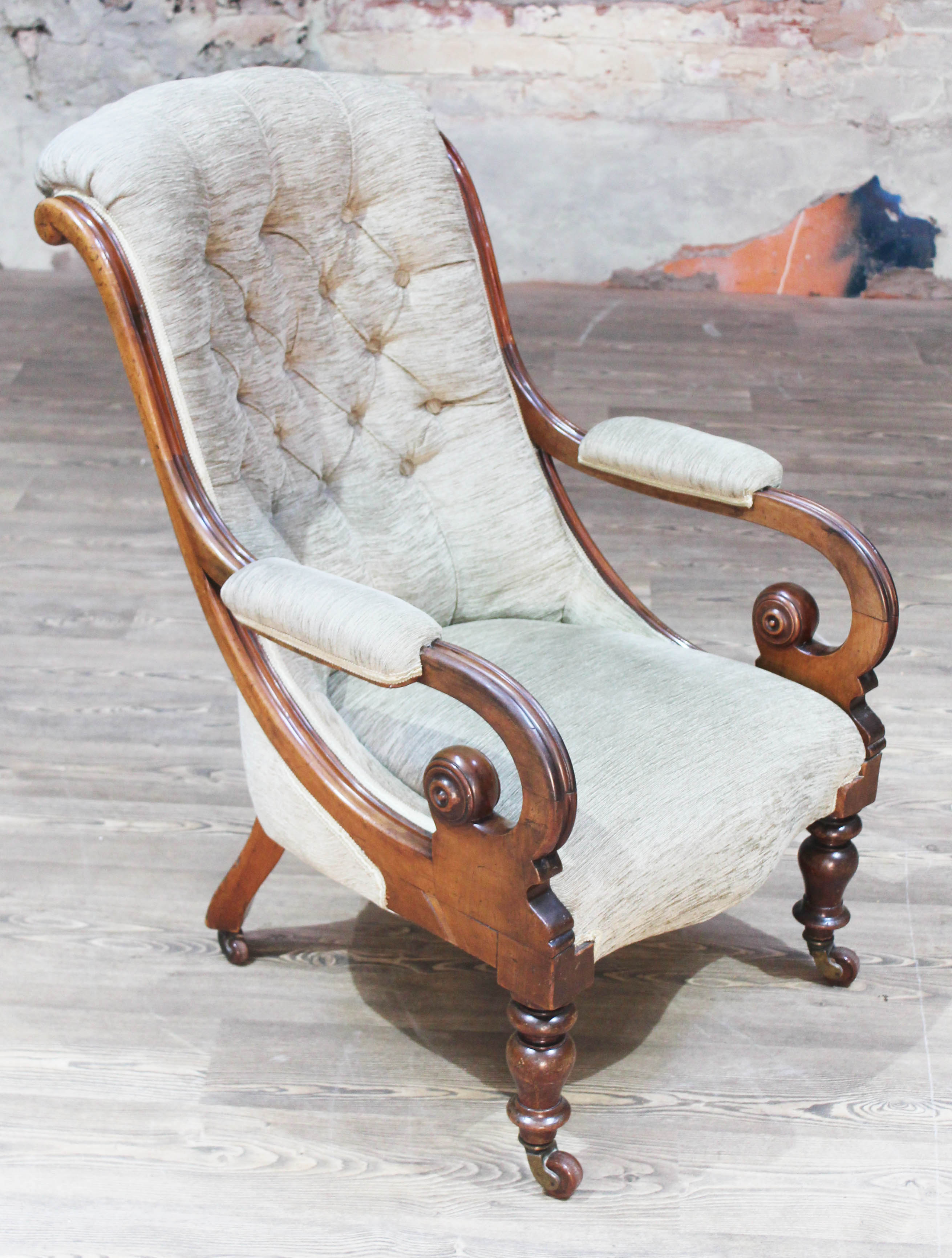 A Victorian walnut armchair with scroll arms, width 69cm, depth 84cm & height 99cm.