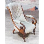 A Victorian walnut armchair with scroll arms, width 69cm, depth 84cm & height 99cm.