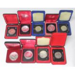 Nine Canadian 50% silver proof dollars, each with case.