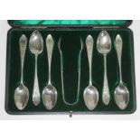 A cased set of six late Victorian bright cut engraved silver teaspoons and matching sugar tongs,