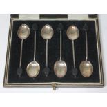 A cased set of six hallmarked silver bean spoons.