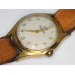 A vintage 1950s Ingersoll gold plated wristwatch with signed champagne guilloche dial, gold tone