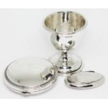 A mixed lot of hallmarked silver comprising a compact, a pill box and an egg cup.