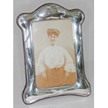 A contemporary Art Nouveau style hallmarked silver photo frame, height 19cm.