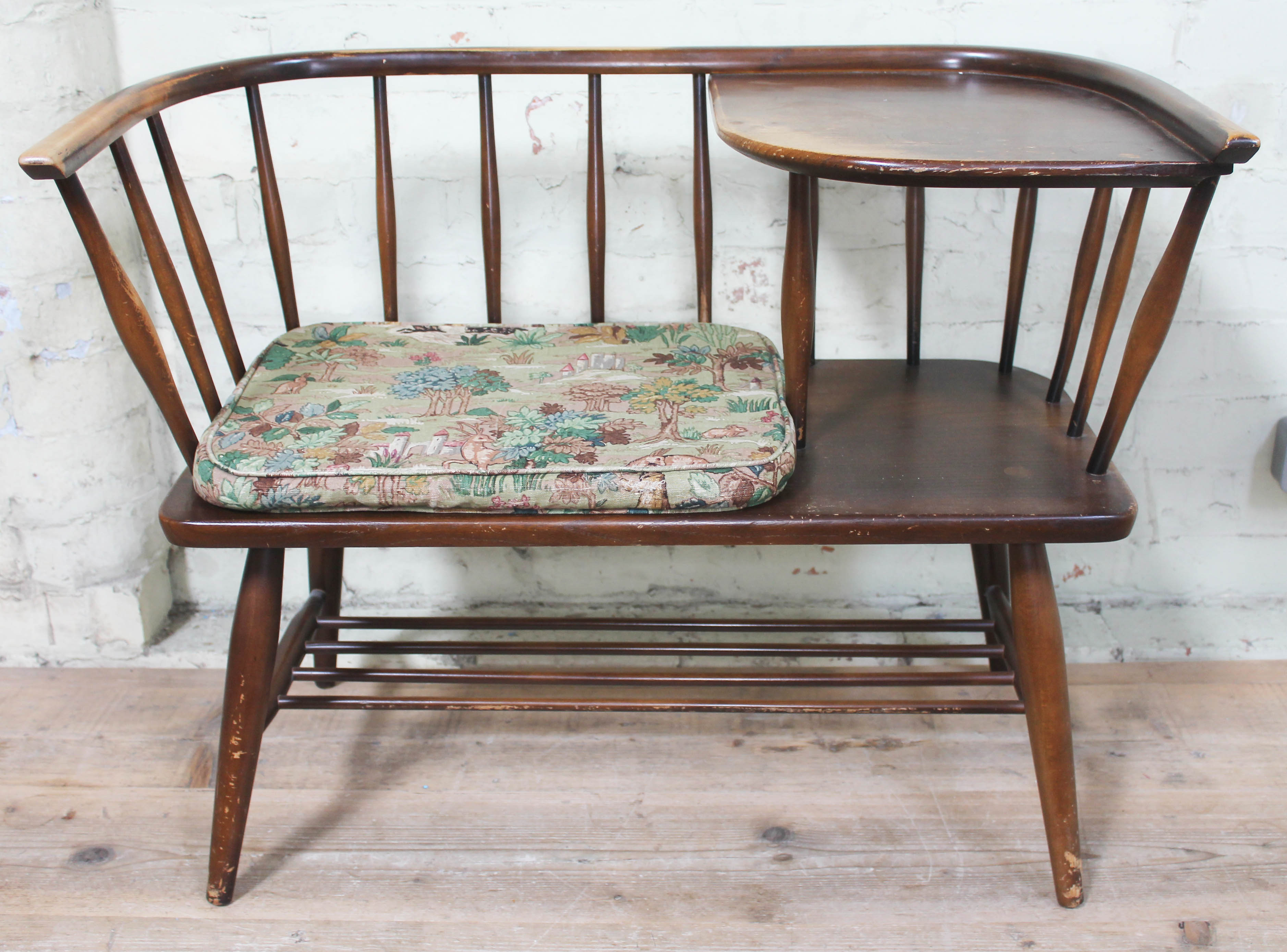 An Ercol dark elm and beech telephone seat, length 87cm. Condition - appears damage/repair free,