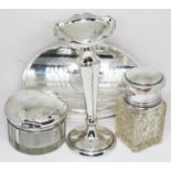 A mixed lot of hallmarked silver comprising a brush, a vase and two silver topped glass jars.