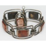 A Polish silver bracelet with amber slabs and matching ring.