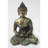 A Tibetan bronze seated buddha, height 24cm.