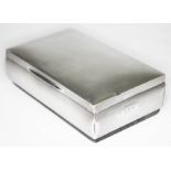 An Art Deco silver cigarette box, Hasset & Harper Ltd, Birmingham 1934, length 15.5cm.