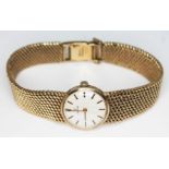 A 1969 hallmarked 9ct gold ladies Omega wristwatch and bracelet strap, ref 1061, with 17 jewel