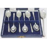 A cased set of six hallmarked silver teaspoons and another three hallmarked silver spoons.