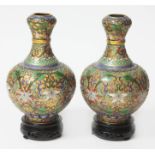 A pair of 20th century cloisonne vases, one labelled 'Jingfa' with wooden bases, height 20.5cm.