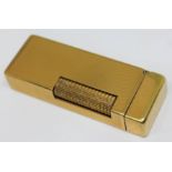 A vintage gold plated Dunhill lighter.