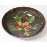 A Moorcroft pottery bowl decorated in orchid pattern, diam. 23.5cm. Condition - appears free from