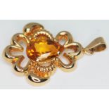 A drop pendant featuring a pear shaped mixed cut citrine, marked '750', gross wt. 6.89g, length