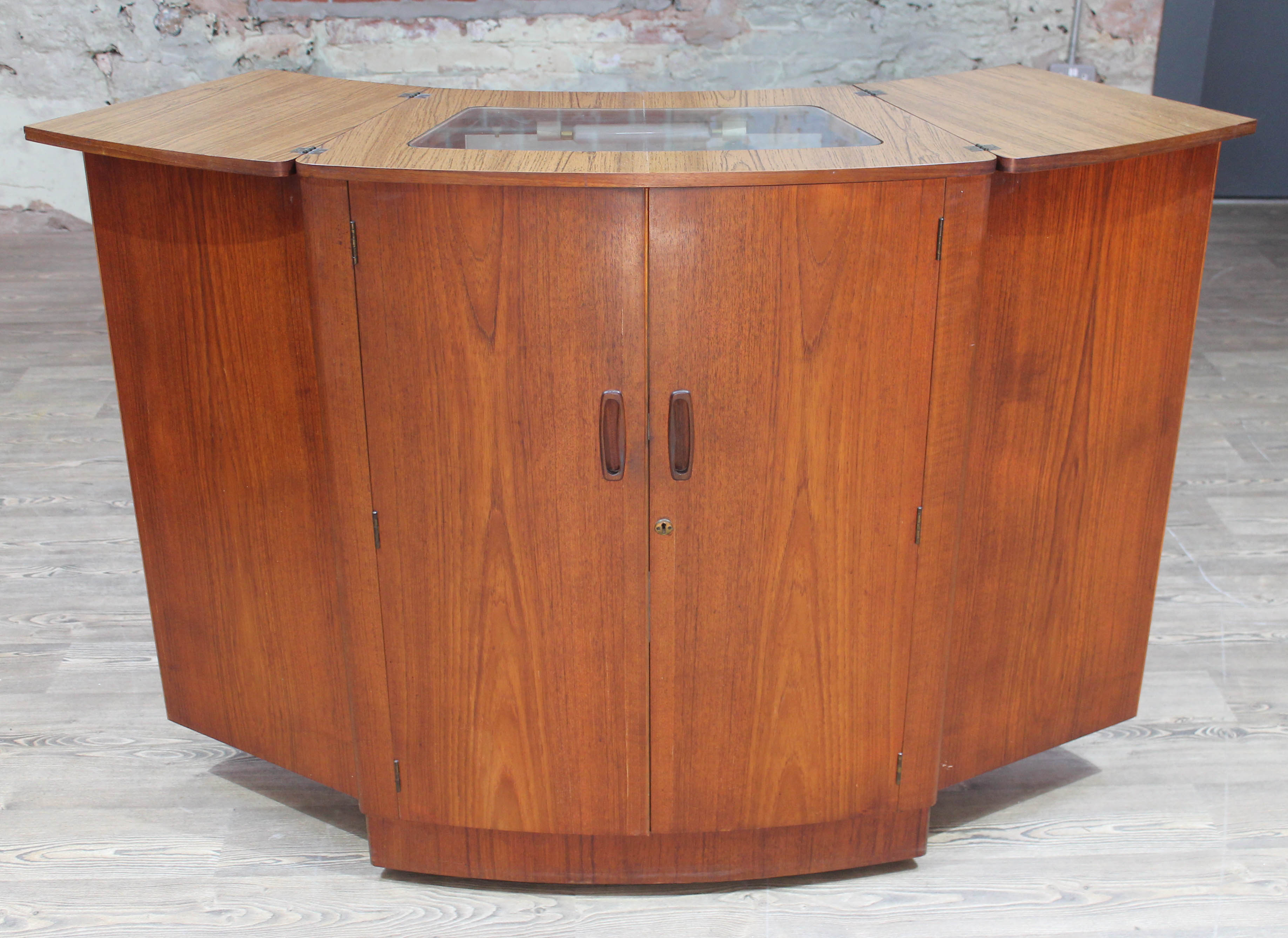 A retro 1960s teak fold out cocktail cabinet bar by Turnidge London, min. width 83cm, extending to
