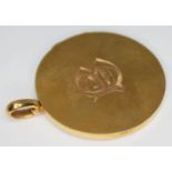 A late Edwardian 15ct gold pendant locket, Barnet Henry Joseph & Co, Birmingham 1917, diam. 32mm,