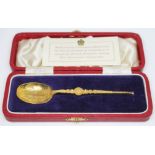 A hallmarked silver gilt replica coronation anointment spoon with fitted case and certificate.