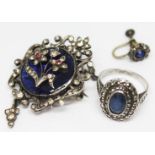 A white metal and enamel pendant brooch set with paste, length 42mm, together with a blue paste
