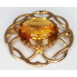 A hallmarked 9ct gold brooch set with a mixed cut citrine, gross wt. 8.32g, length 33m.