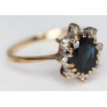 A hallmarked 9ct gold diamond and sapphire cluster ring, gross wt. 2.51g, size Q.