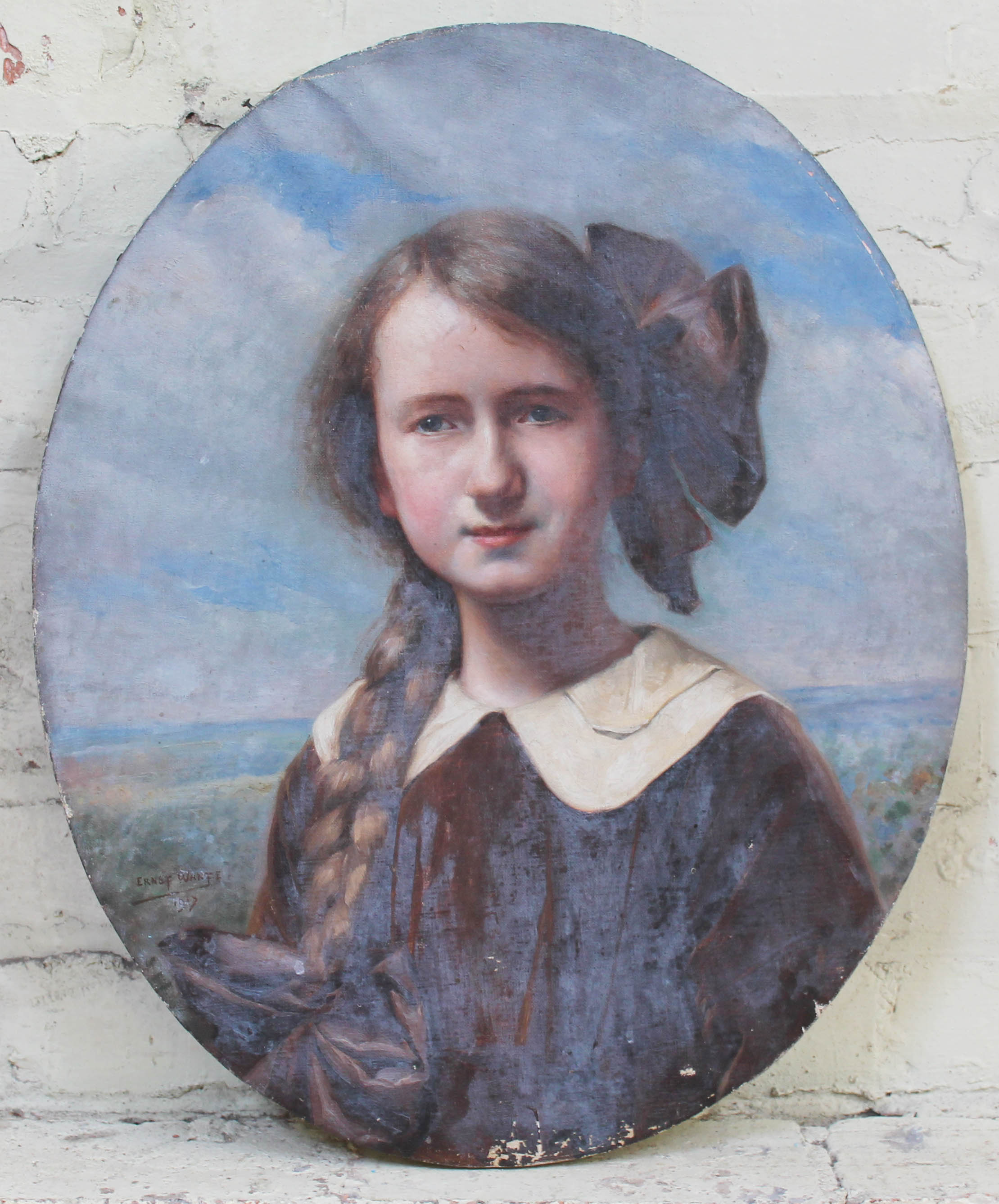 Early 20th century school, oval portrait depicting a girl, oil on canvas, 46cm x 56cm, signed 'Ernst