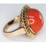 A Polish ring set with a large coral cabochon, Polish 14ct gold marks, Wrochaw essay mark, gross wt.