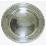 A hallmarked silver dish with gadrooned rim, diam. 16.5cm, wt. 4oz.