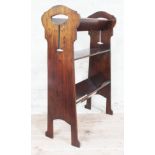 An Edwardian Arts & Crafts style magazine or book stand, height 85.5cm.