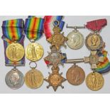 A mixed lot of WWI medals comprising a pair awarded to 2395 DVR J WOLFENDEN RA, two Victory medals