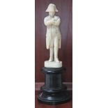 A French 19th century carved figure depicting Napoleon Bonaparte on turned wooden plinth, height